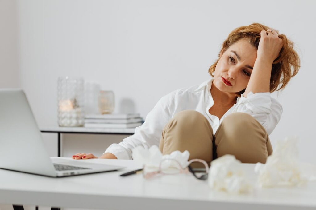 Woman working in her office having flu